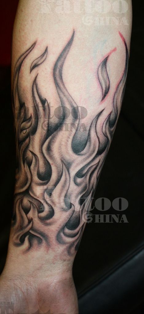 Black And Grey Fire Flame Tattoo On Forearm By Marc Riedel