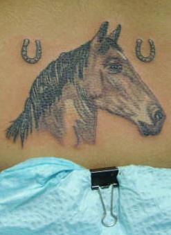 Black And Grey Horse Head With Two Little Horseshoe Tattoo Design