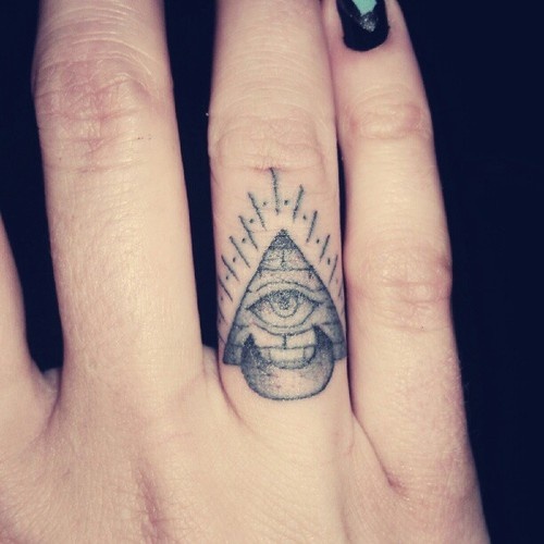 Black And Grey Illuminati Eye With Half Moon Tattoo On Girl Finger