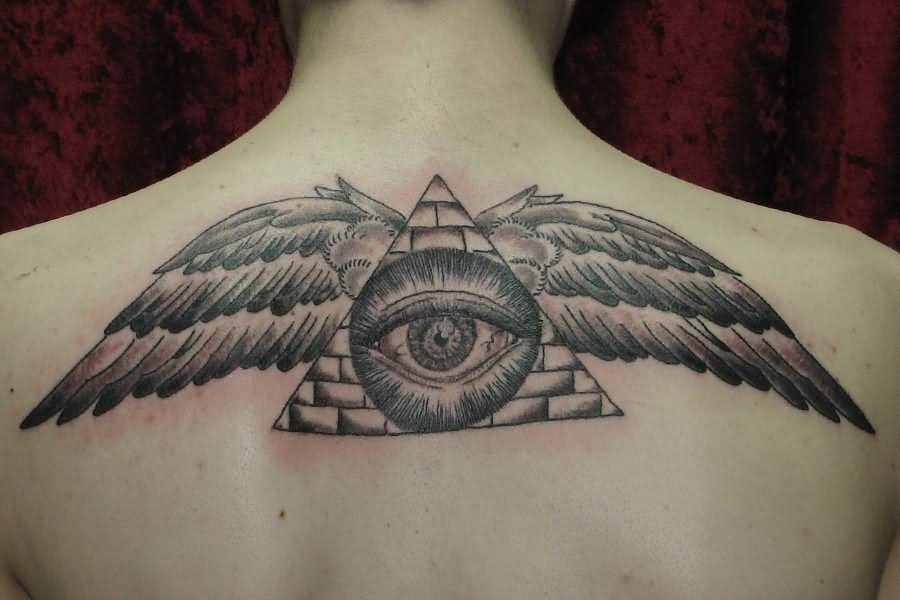 Black And Grey Illuminati Eye With Wings Tattoo On Man Upper Back