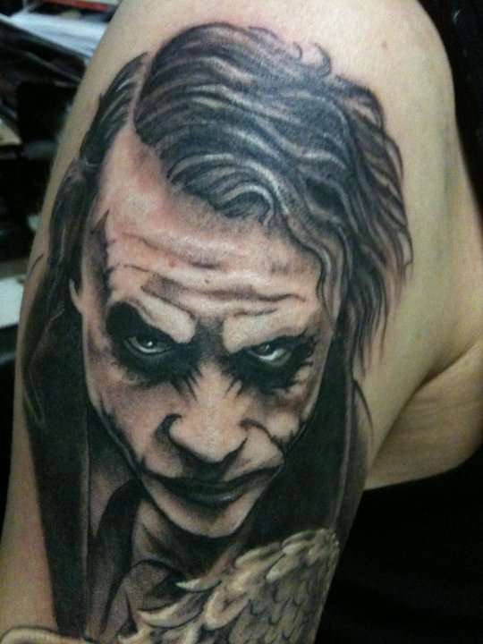 Black And Grey Joker Face Tattoo On Shoulder