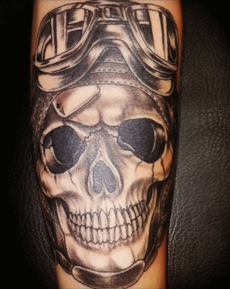 Black And Grey Monster Skull Tattoo On Forearm