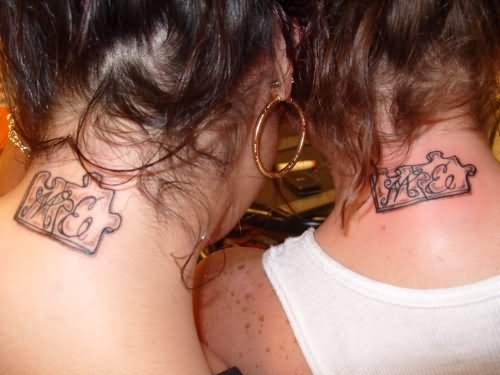 Black And Grey Puzzle Tattoo On Girl's Back Neck