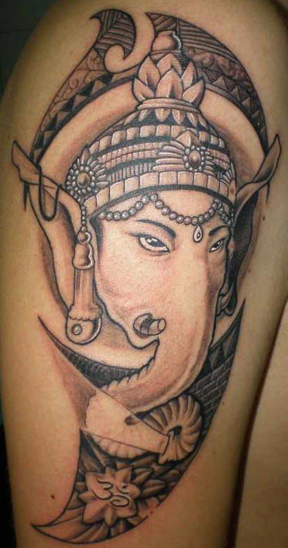 Black And Grey Religious Lord Ganesha Face Tattoo On Shoulder
