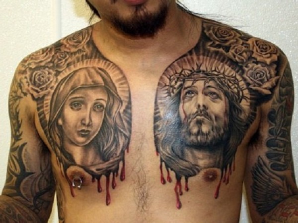 Black And Grey Religious Saint Mary And Jesus Tattoo On Man Chest