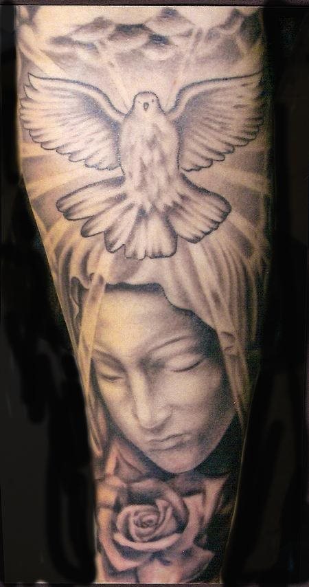 Black And Grey Religious Saint Mary Face With Dove And Rose Tattoo On Forearm