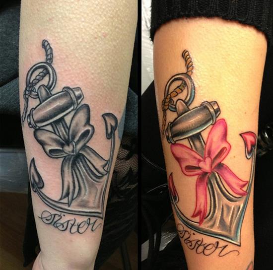 Black And Grey Sister Word And Anchor With Ribbon Bow Tattoo On Forearm