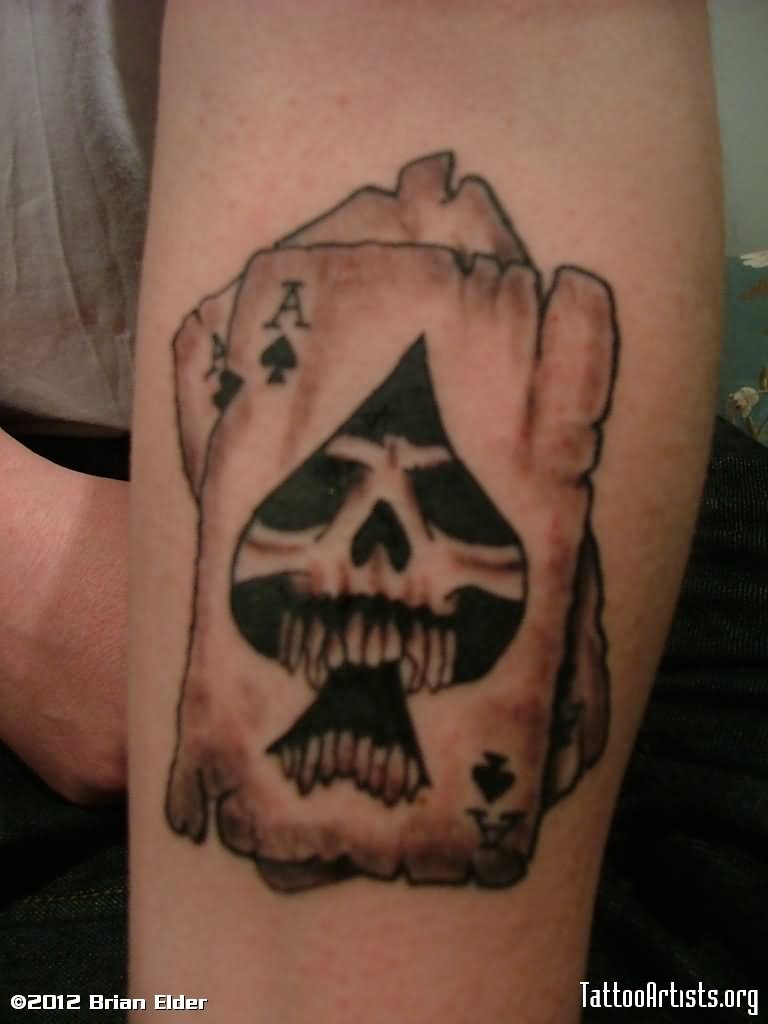 Black And Grey Skull In Ace Of Spade Tattoo Design