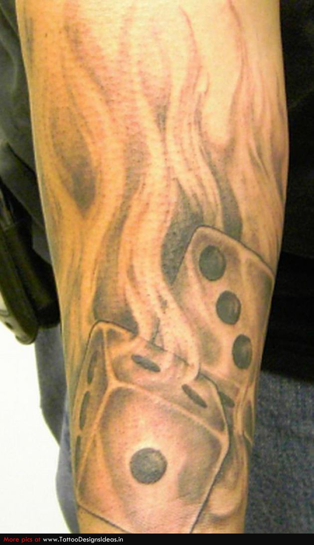 Black And Grey Two Dice In Fire Tattoo On Forearm