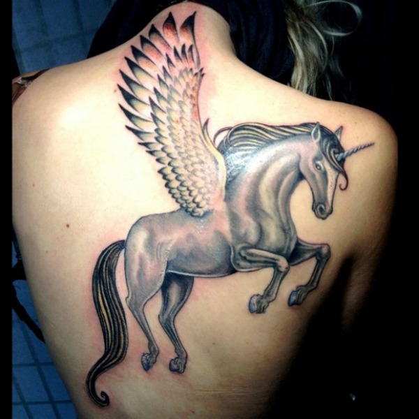 Black And Grey Unicorn With Flying Wings Tattoo On Upper Back