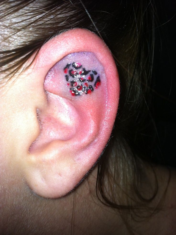 Black And Red Heart Tattoo On Inside The Ear
