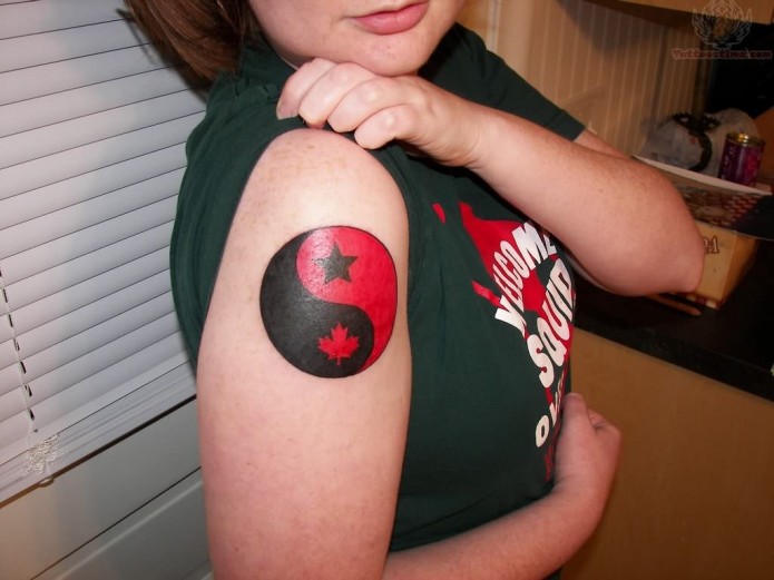 Black And Red Star And Maple Leave In Yin Yang Tattoo On Girl Shoulder