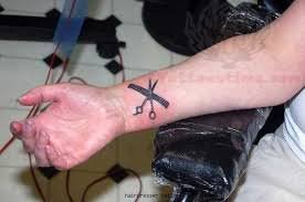 Black Comb In Scissor Tattoo On Wrist