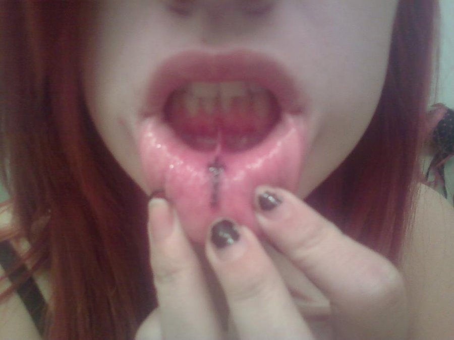 Black Cross Tattoo On Girl Inner Lip By Alison