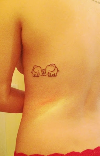 Black Cute Two Elephant Calf Tattoo On Upper Side Rib