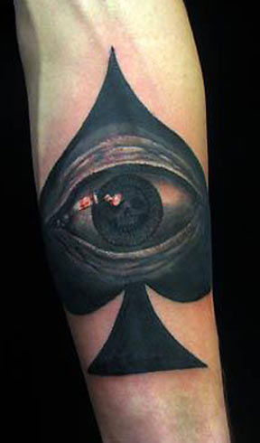 Black Eye In Ace Tattoo On Forearm