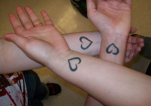 Black Heart Tattoo On Three Sister Wrists