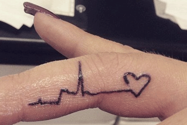 Black Heart With Heartbeat Tattoo On Girl Finger
