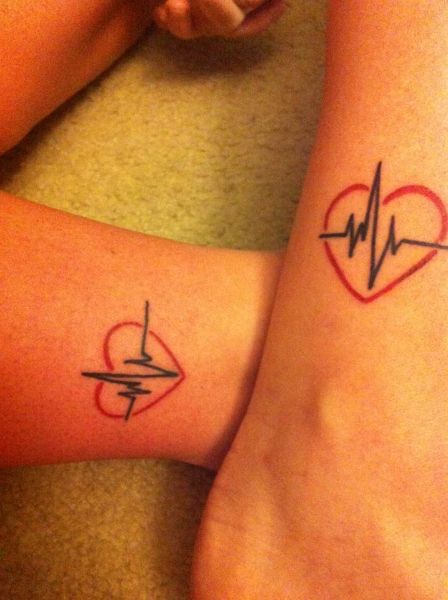 Black Heartbeat In Red Heart Tattoo On Leg