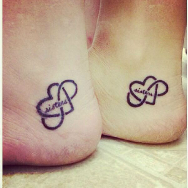 Black Infinity Sisters In Heart Tattoo On Heel