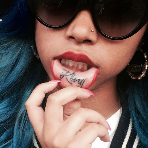 Black King Tattoo On Girl Inner Lip