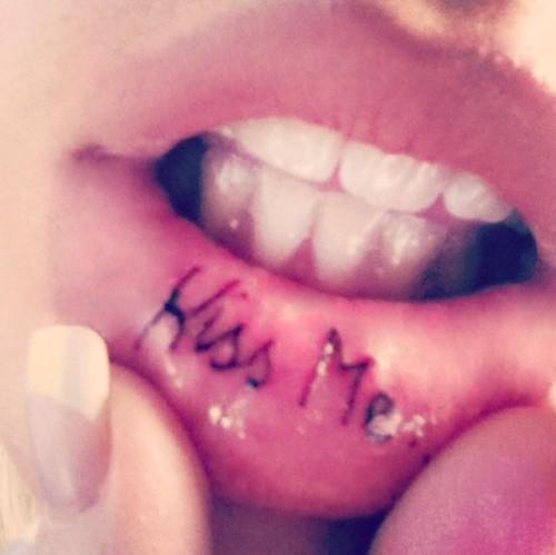 Black Kiss Me Tattoo On Inner Lip