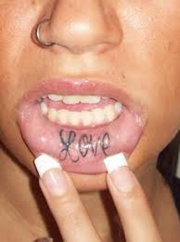 Black Love Tattoo On Girl Inner Lip