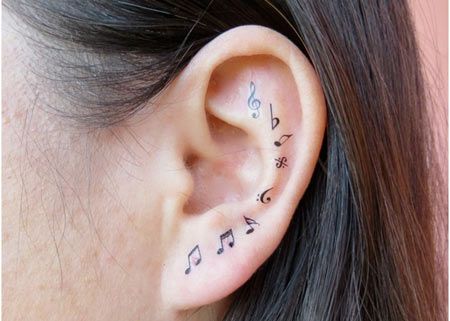 Black Music Note Tattoo On Girl Ear