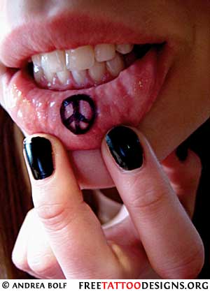 Black Peace Sign Tattoo On Girl Inner Lip