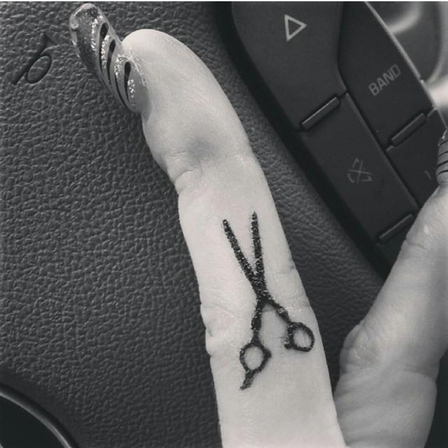 Black Scissor Tattoo On Finger