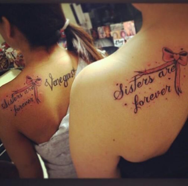 Black Sister Are Forever Word With Ribbon Bow Tattoo On Girls Back Shoulder