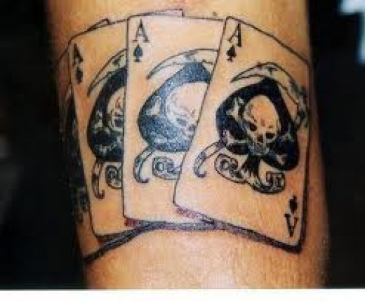 Black Skull In Three Ace Of Spade Tattoo Design