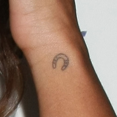 Black Tiny Horseshoe Tattoo On Side Wrist