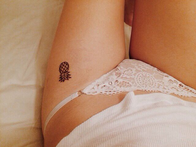 Black Tiny Pineapple Fruit Tattoo On Girl Thigh