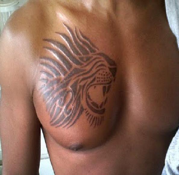 Black Tribal Zodiac Leo Tattoo On Man Chest