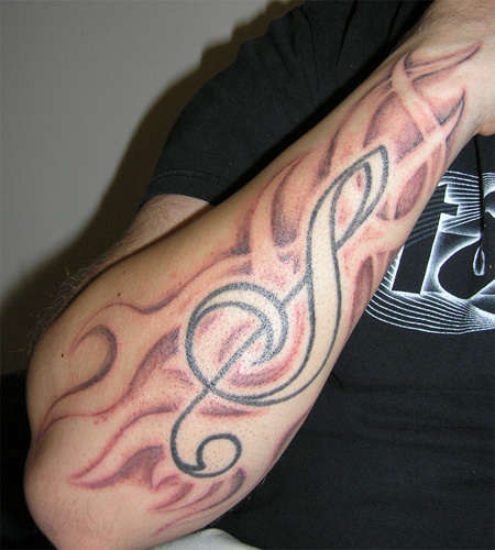 Black Violin Key In Fire Flame Tattoo On Forearm