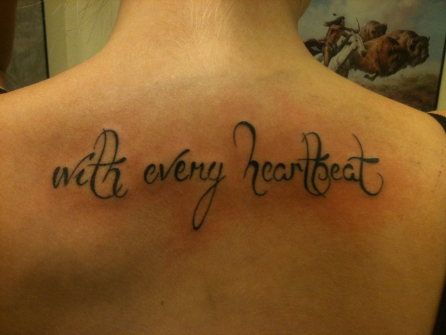 Black With Every Heartbeat Word Tattoo On Upper Back By Florian Schulz