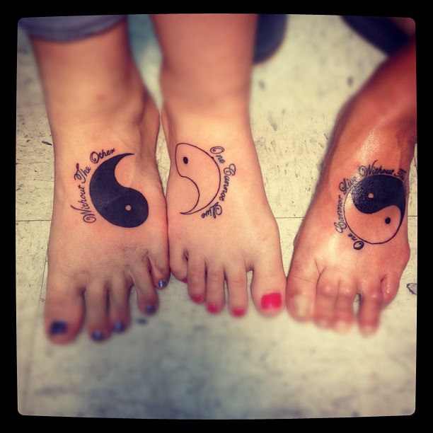 Black Yin Yang Tattoo On Daughters Foot