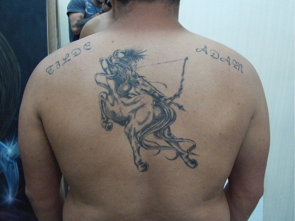 Black and Grey 3D Zodiac Sagittarius Tattoo On Man Upper Back