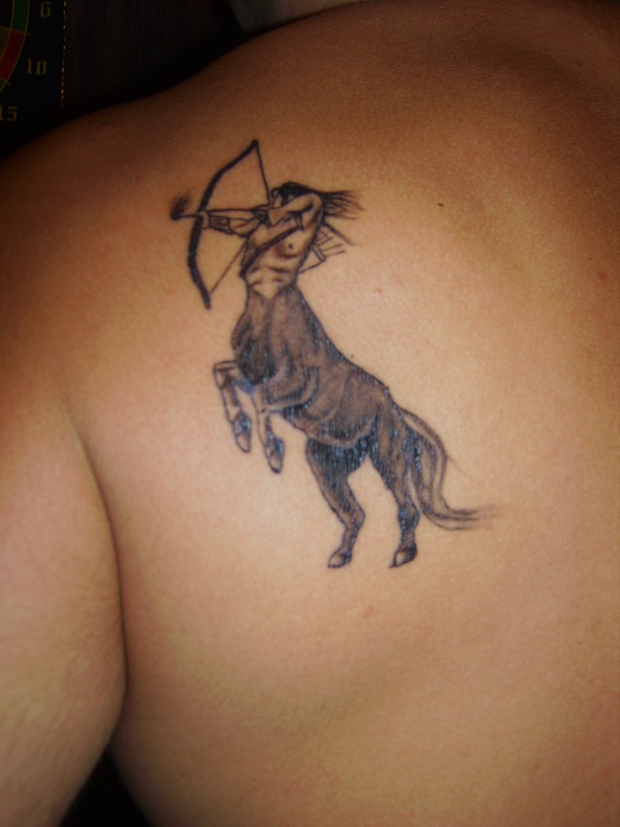Black and Grey Zodiac Sagittarius Tattoo On Man Back Shoulder By Nebojsha