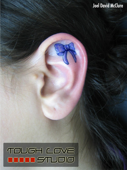Blue Ribbon Bow Tattoo On Girl Inside The Ear