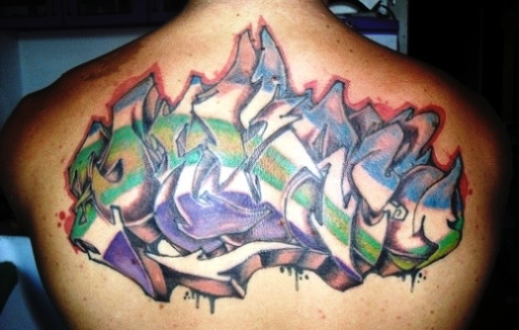 Colored Graffiti Tattoo On Upper Back For Men
