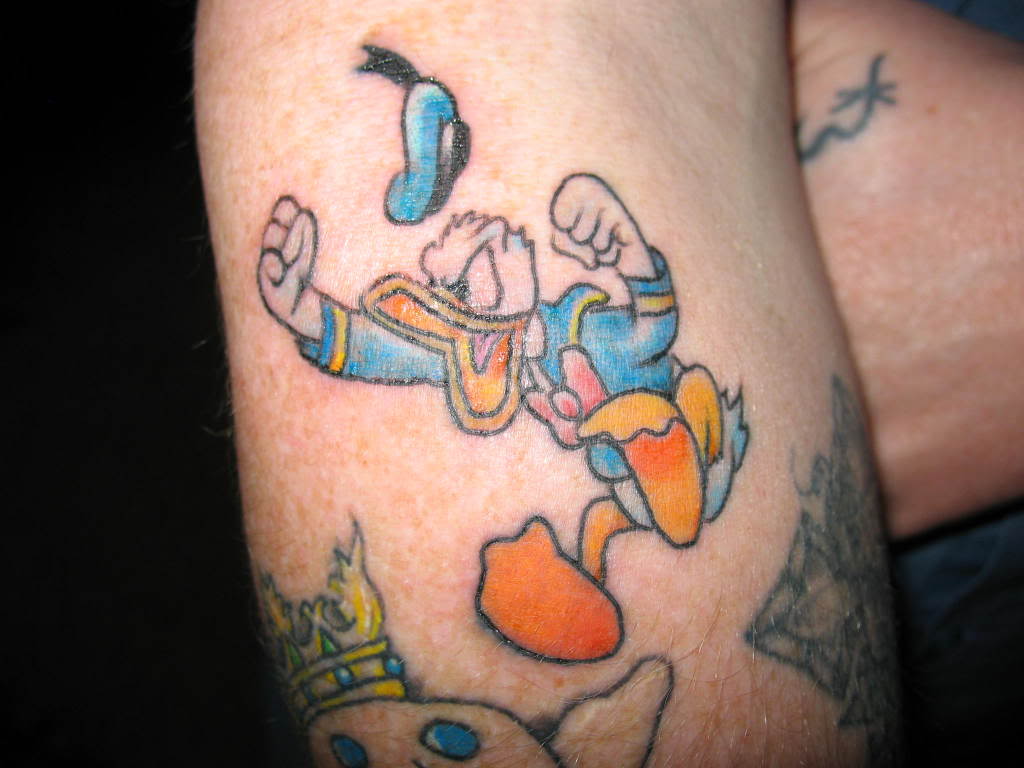 28 Wonderful Cartoon Tattoo Images, Pictures And Designs
