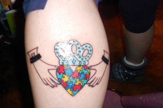 Colorful Heart Puzzle With Crown Tattoo On leg Calf