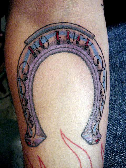 Colorful Horseshoe Tattoo On Forearm