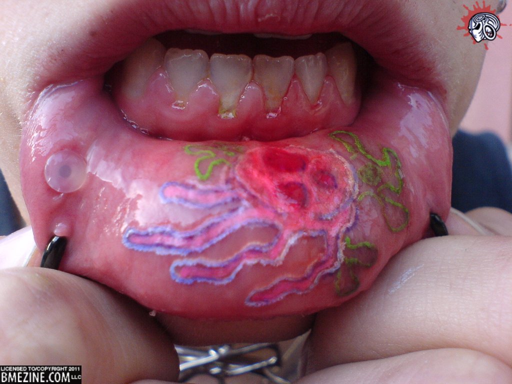 Colorful Jellyfish Tattoo On Inner Lip