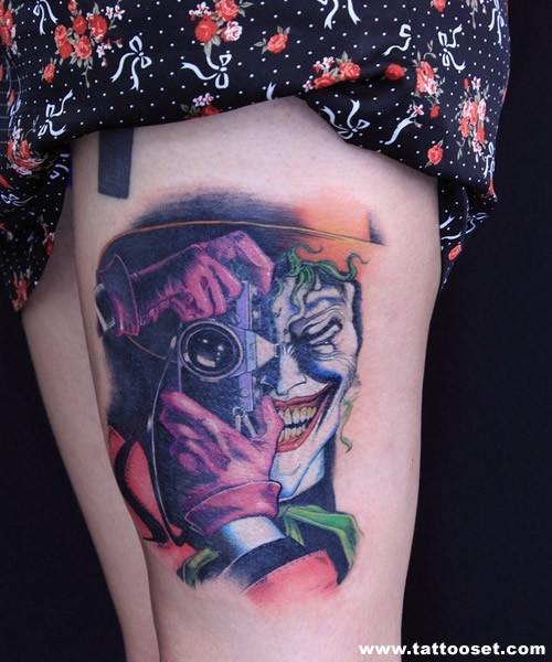 Colorful Joker With Camera Tattoo On Girl Thigh