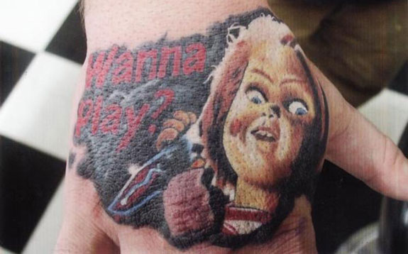Colorful Knife On Chucky Hand Tattoo On Hand