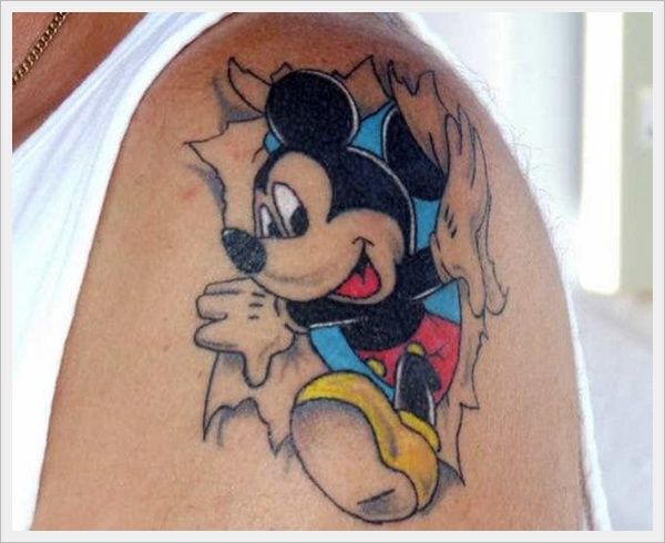 Colorful Ripped Skin Mickey Mouse Cartoon Tattoo On Man Shoulder