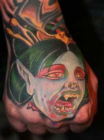 Colorful Vampire Girl Face Tattoo On Hand